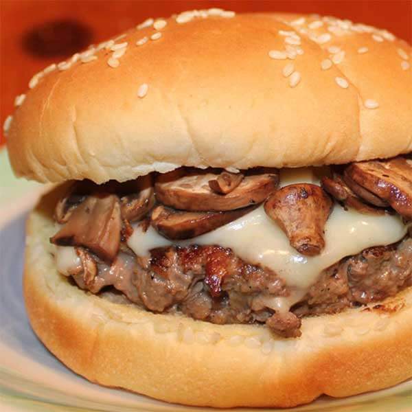 juicy cheeseburger with mushrooms at summit chalet lutsen mountains