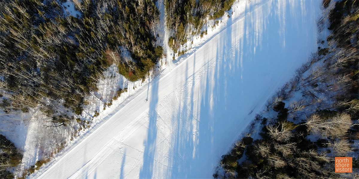 aerial view of cross country skier on ski trail near grand marais mn