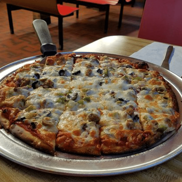 pizza on a table at jimmy's pizza
