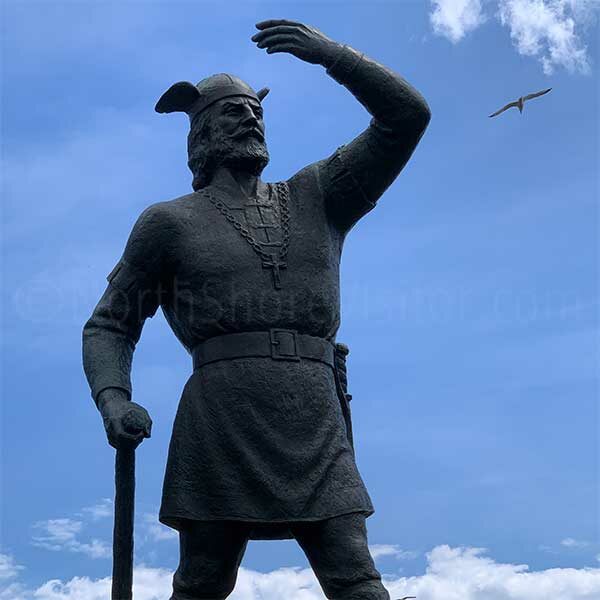 leif erikson statue against blue sky with gull