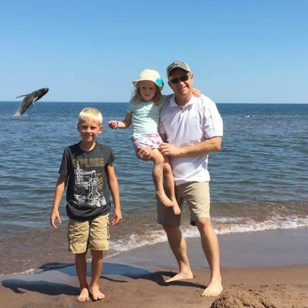 whale jumping behind family at park point in duluth mn