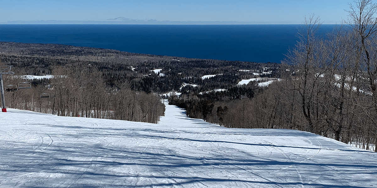 lutsen mountains groomed run and lake superior spread out below