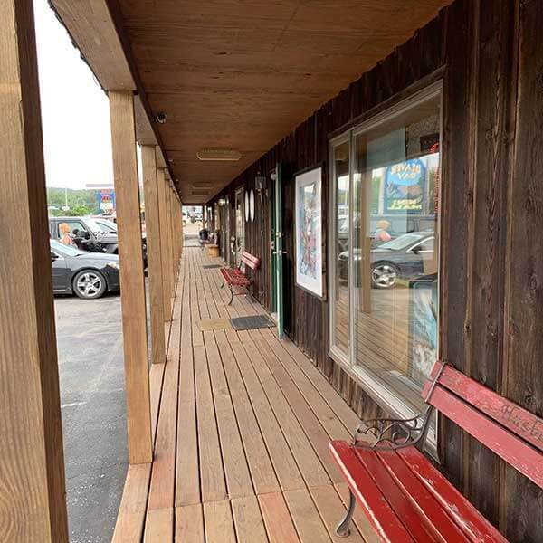 line of shops and restaurants along a boardwalk in beaver bay minnesota